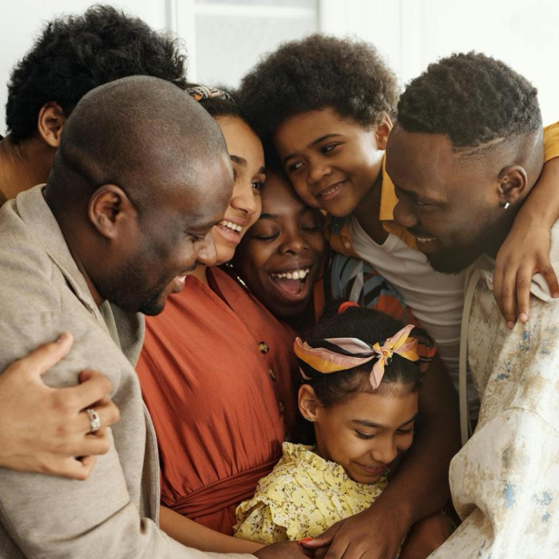 A group of people hugging that showcasing family union used to build relevance to the topic - Sponsorship of spouse, partner, or child in Canada